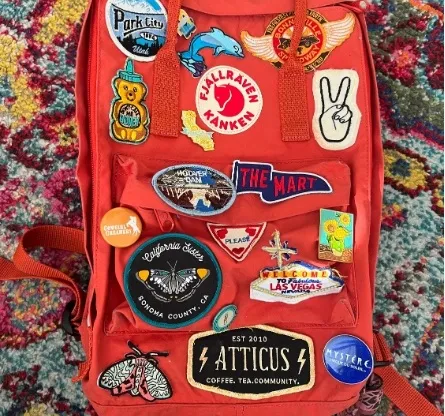 Assorted patches on an orange vest