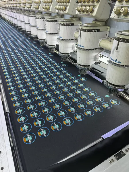 Repeated badge designs on an embroidery machine
