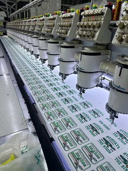 Multi-head embroidery machine at work